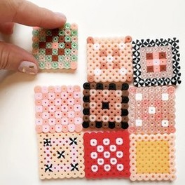 Perler bead coasters in pastel patterns